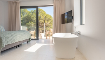 Resa estate modern villa for sale ibiza first line north tub bedroom.jpg